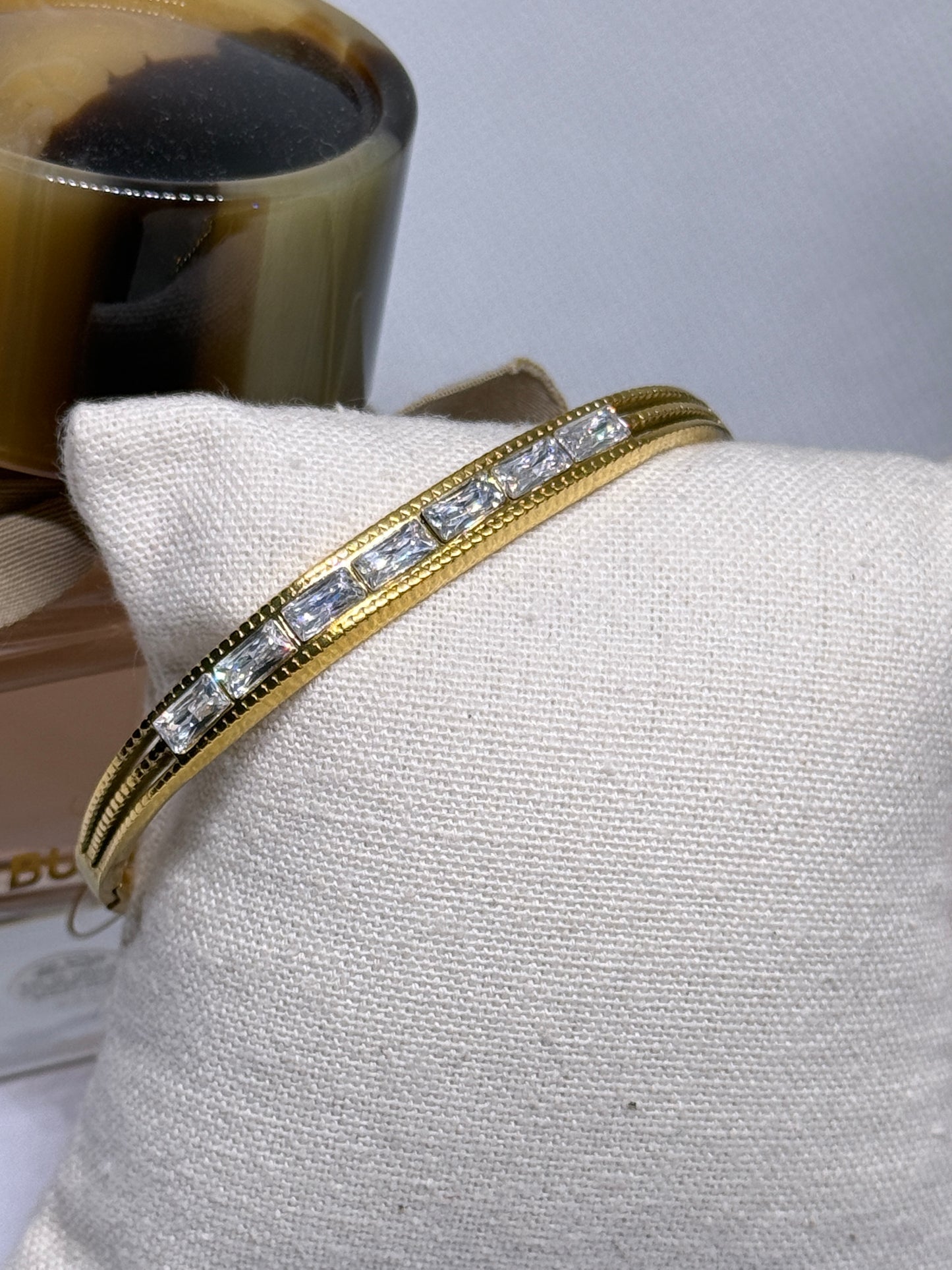 Gold bangle with glittering stone embossed