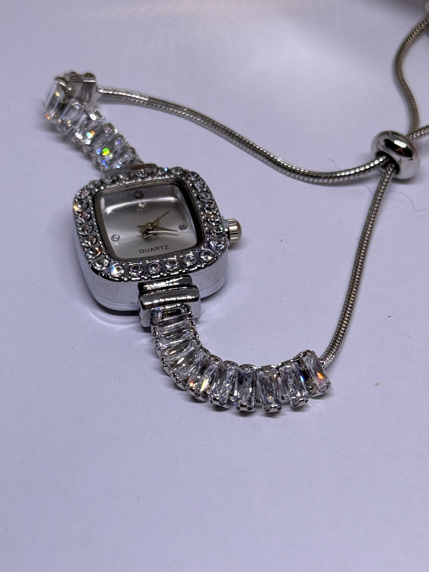 Silver tone rhinestone bracelet watch