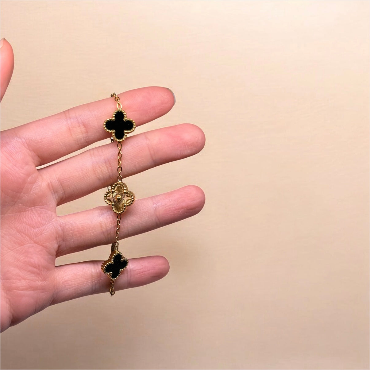 Golden bracelet with clover charm black and gold colour | stainless steel shinny decor bracelet