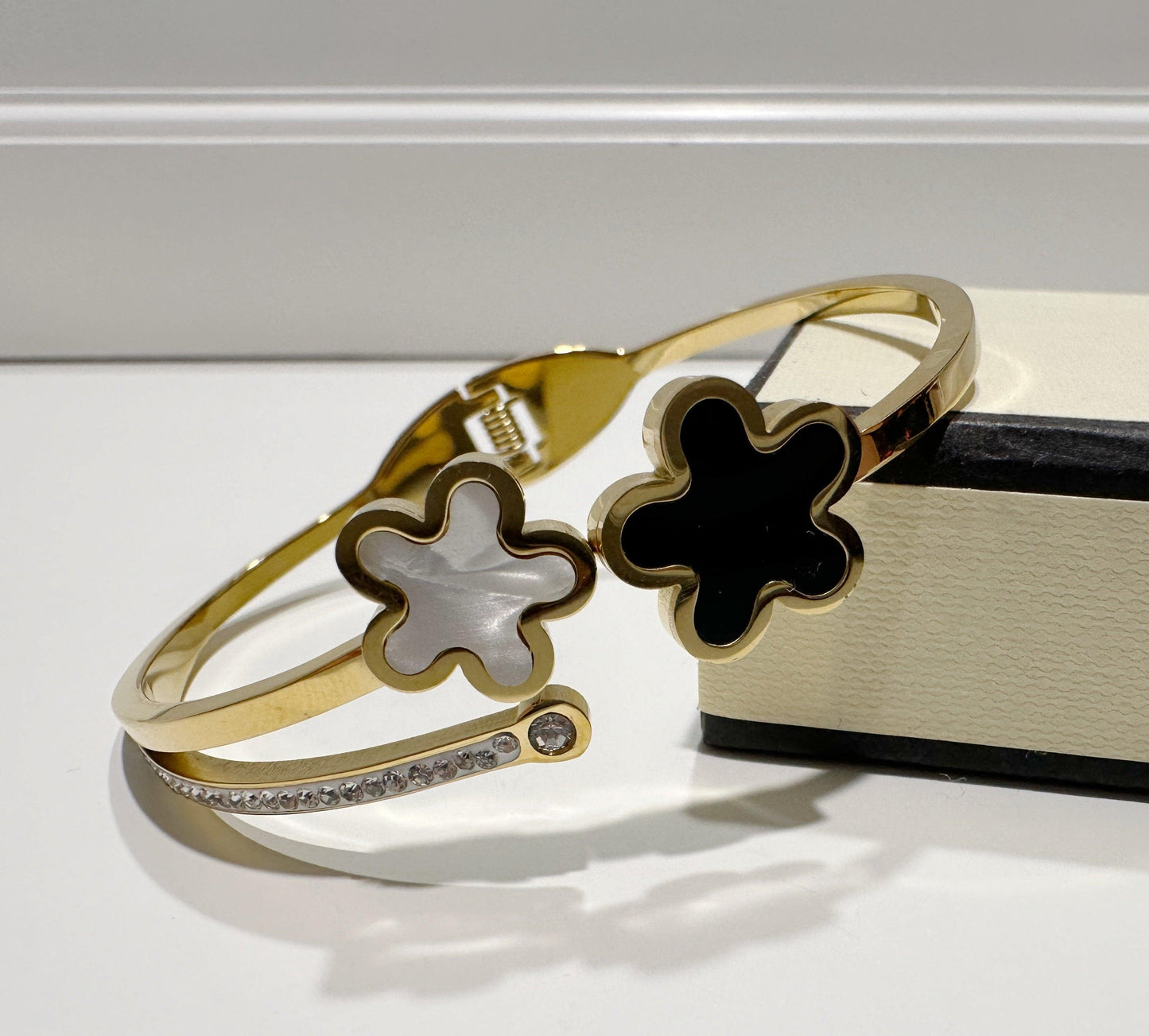 <p>Golden plated bangle with clover pattern.</p> <p> </p>