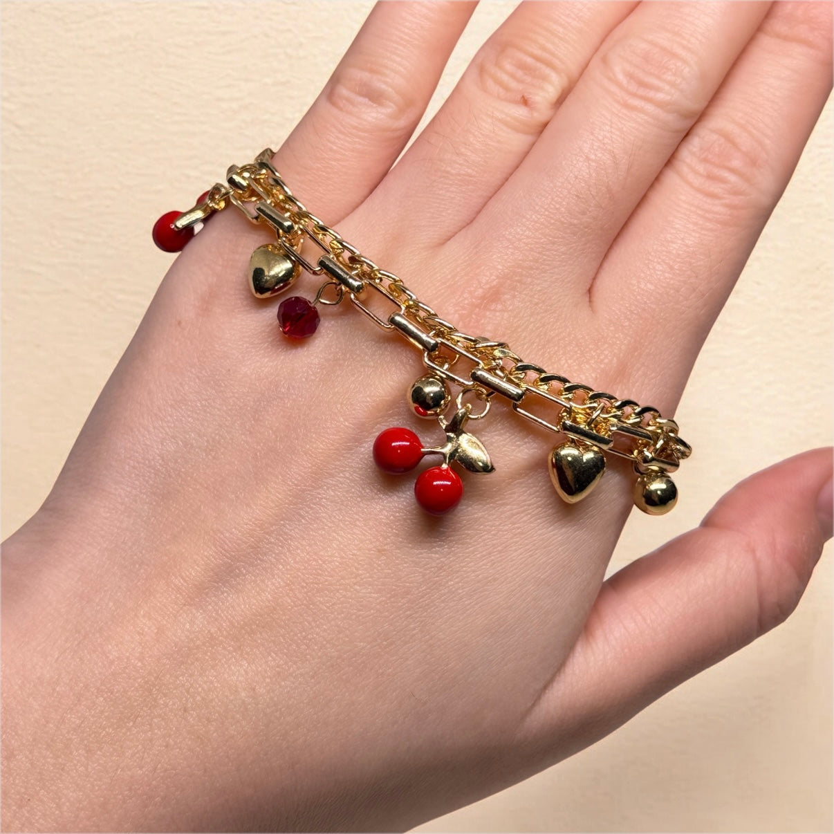 Golden chain bracelets with cherry and heart beads
