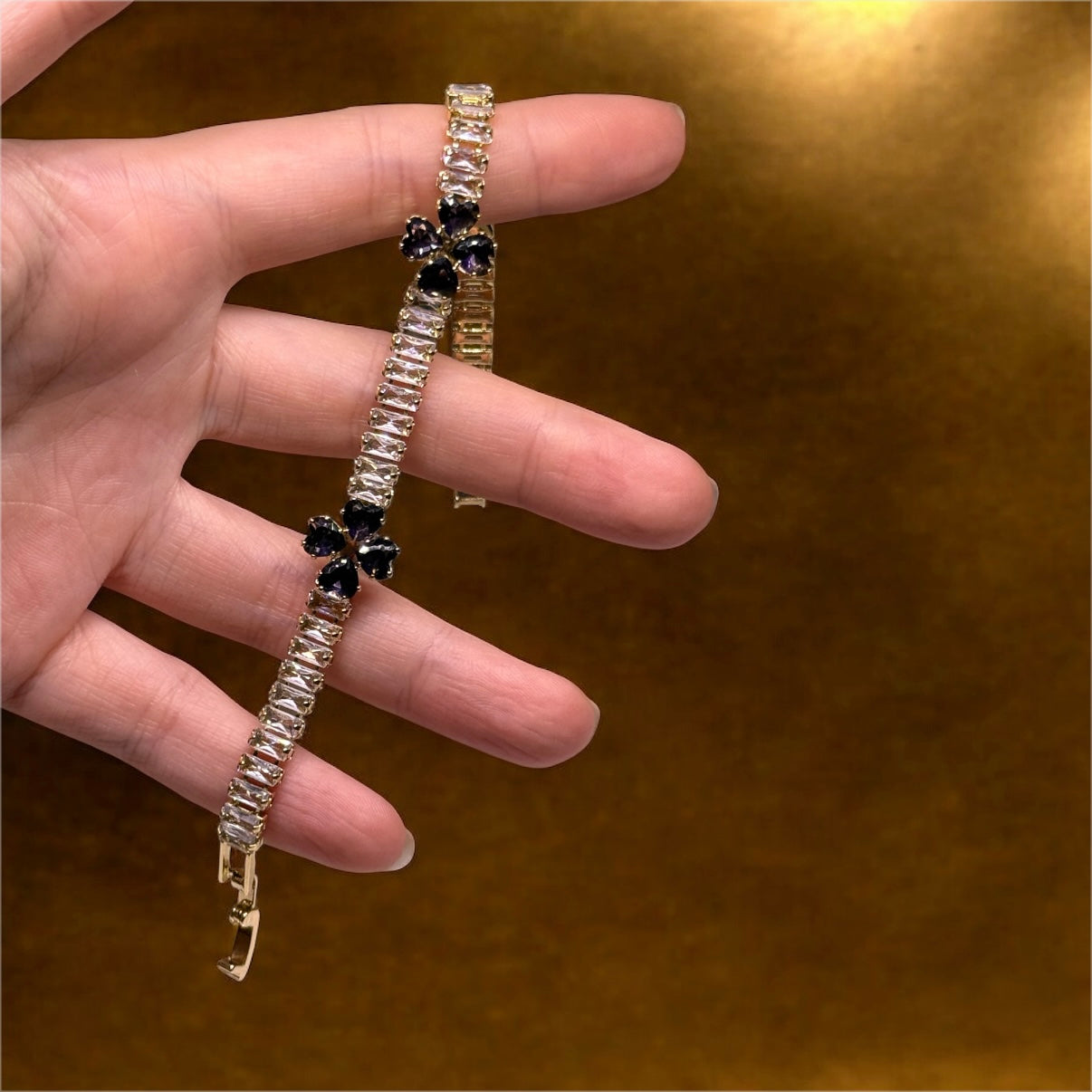 Gold bracelet with clover patterns | purple zircon embossed