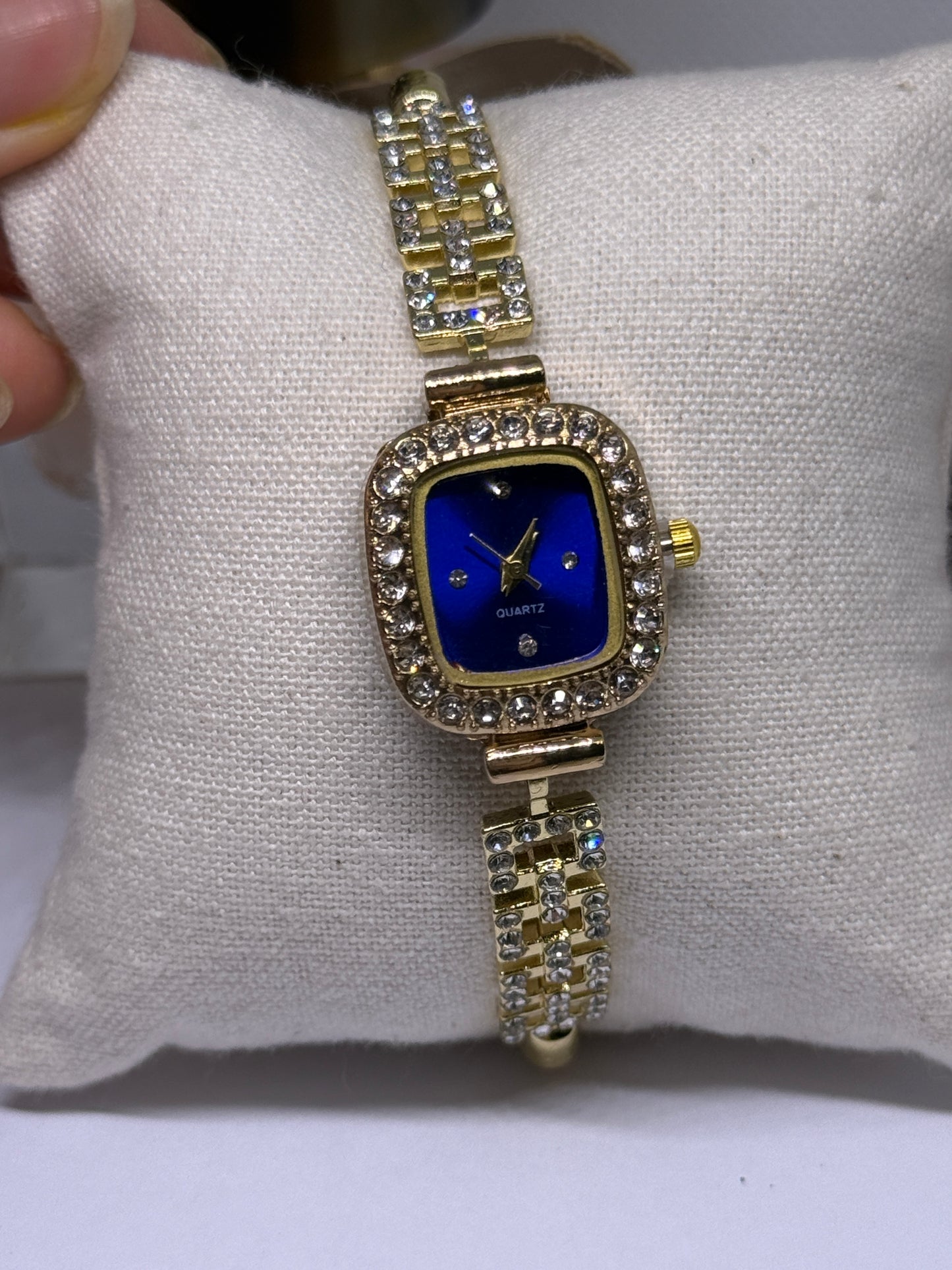 Golden tone bracelet watch in blue