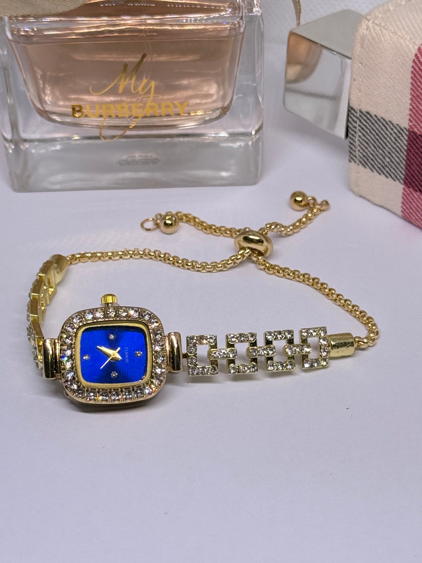 Golden tone bracelet watch in blue