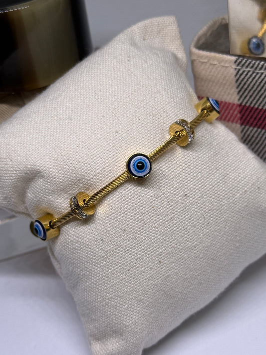 Gold evil eye bracelet with cubic zirconia and rhinestone details