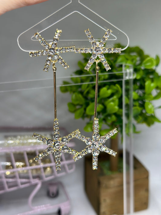 Gold glittering starburst earrings| silver stars diamante dangle earrings | Celestial snowflakes drop earrings | swing Christmas earrings