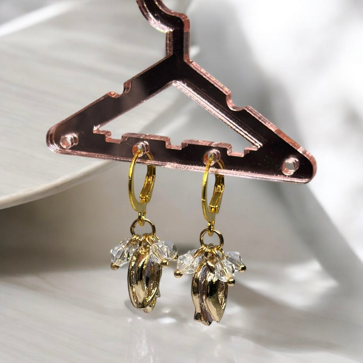 Golden flower dangle earrings with clear beads