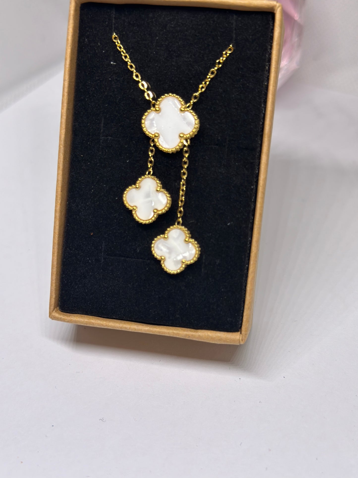 Golden clover necklaces