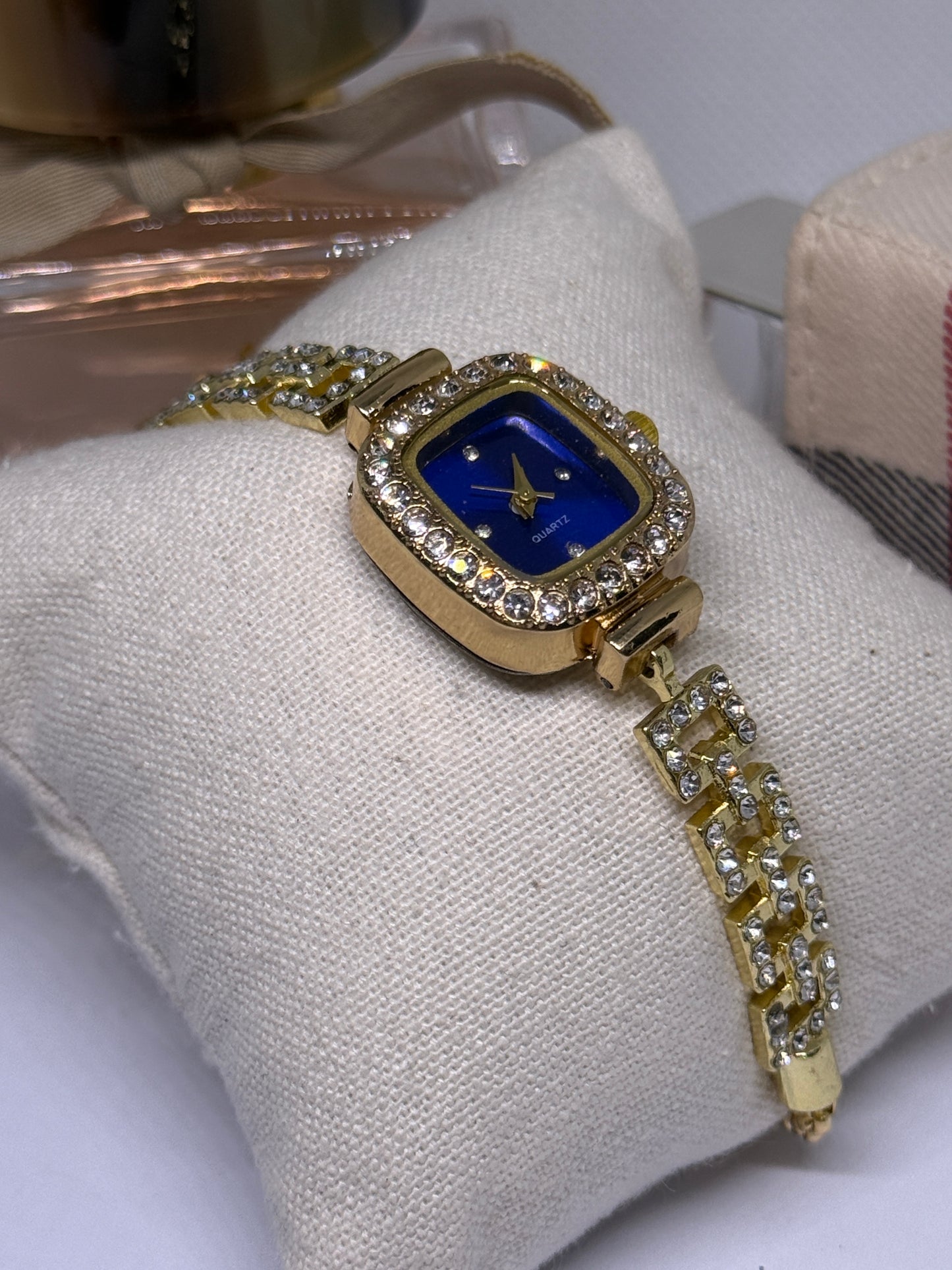 Golden tone bracelet watch in blue