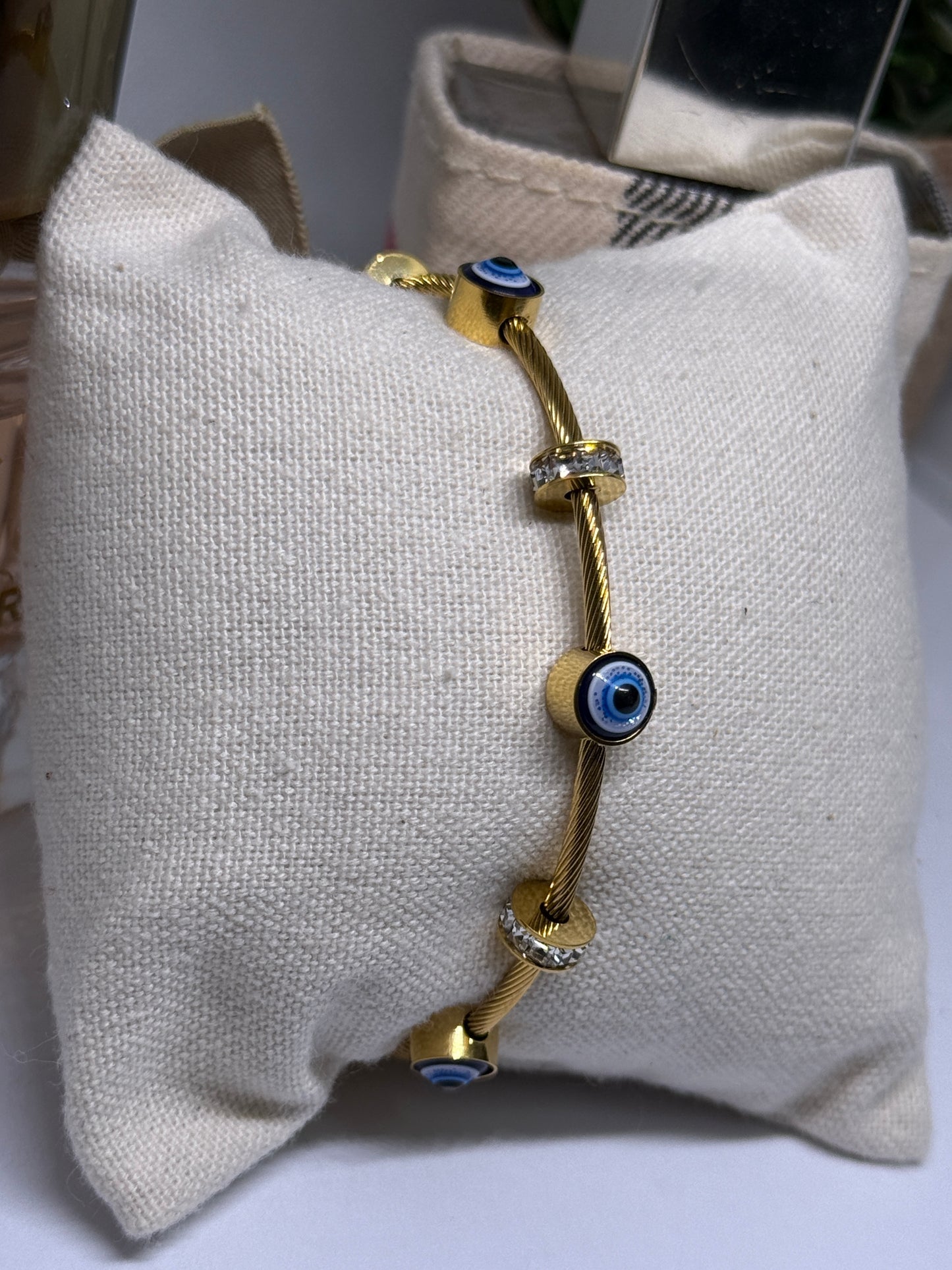 Gold evil eye bracelet with cubic zirconia and rhinestone details