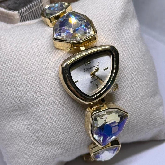 Gold tone crystal rhinestone watch with silver stone