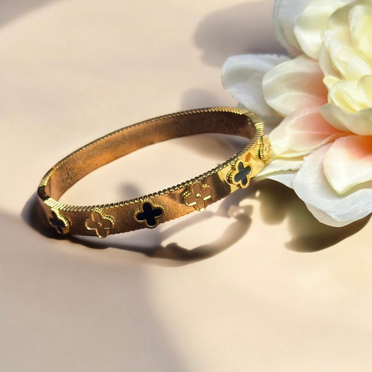 Gold bangle with black clover pattern | rhinestones embossed