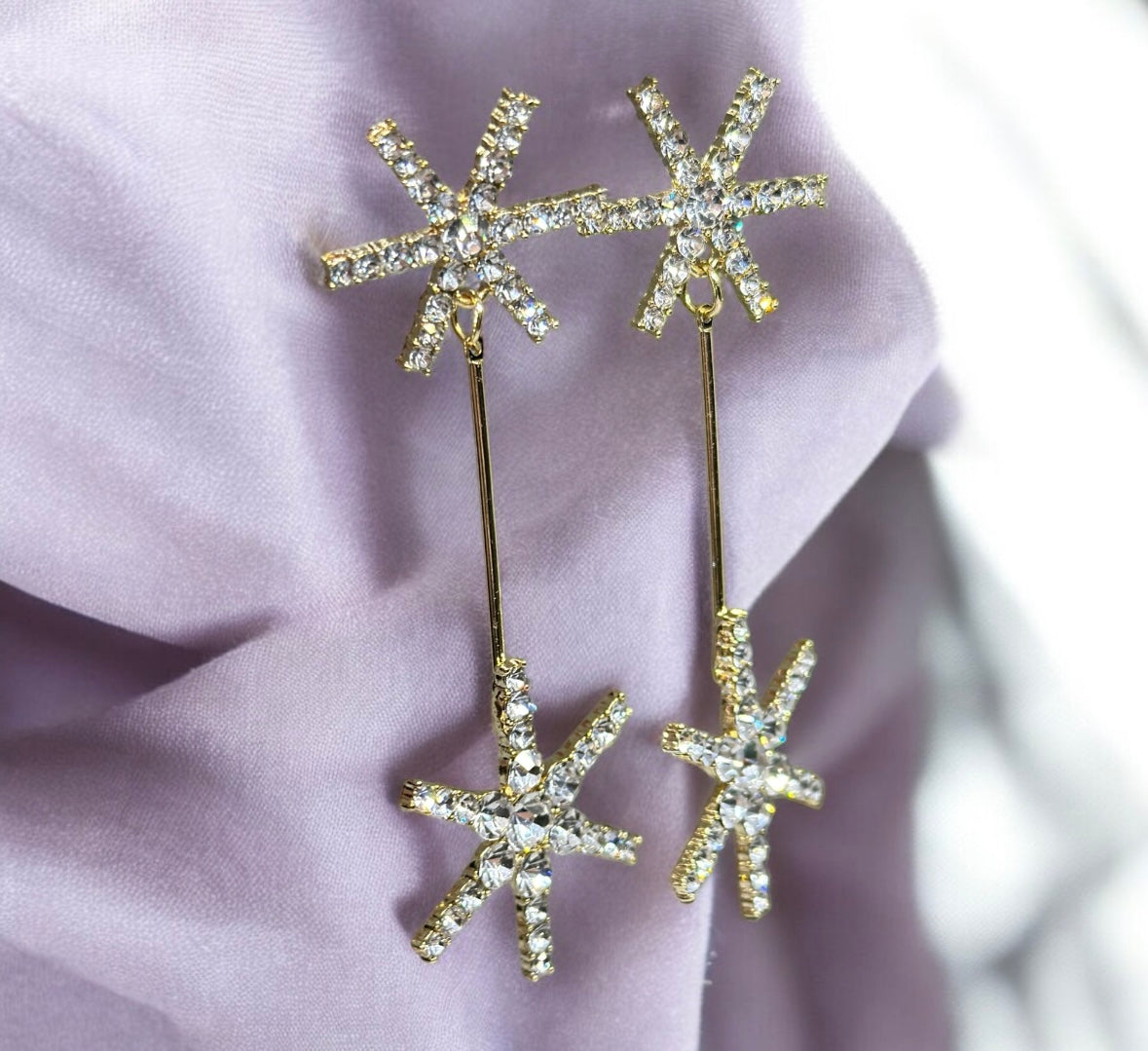 Gold glittering starburst earrings| silver stars diamante dangle earrings | Celestial snowflakes drop earrings | swing Christmas earrings