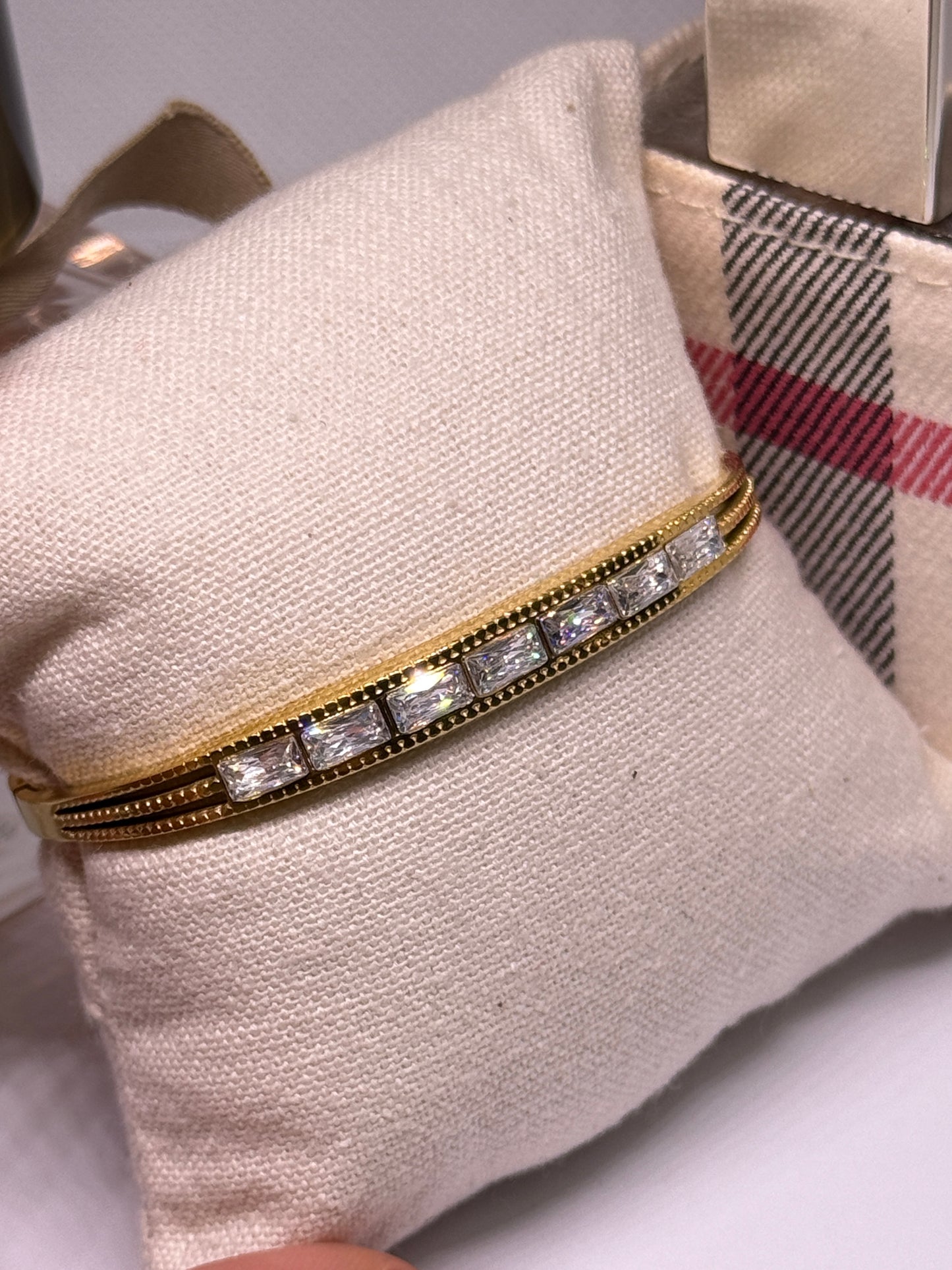 Gold bangle with glittering stone embossed