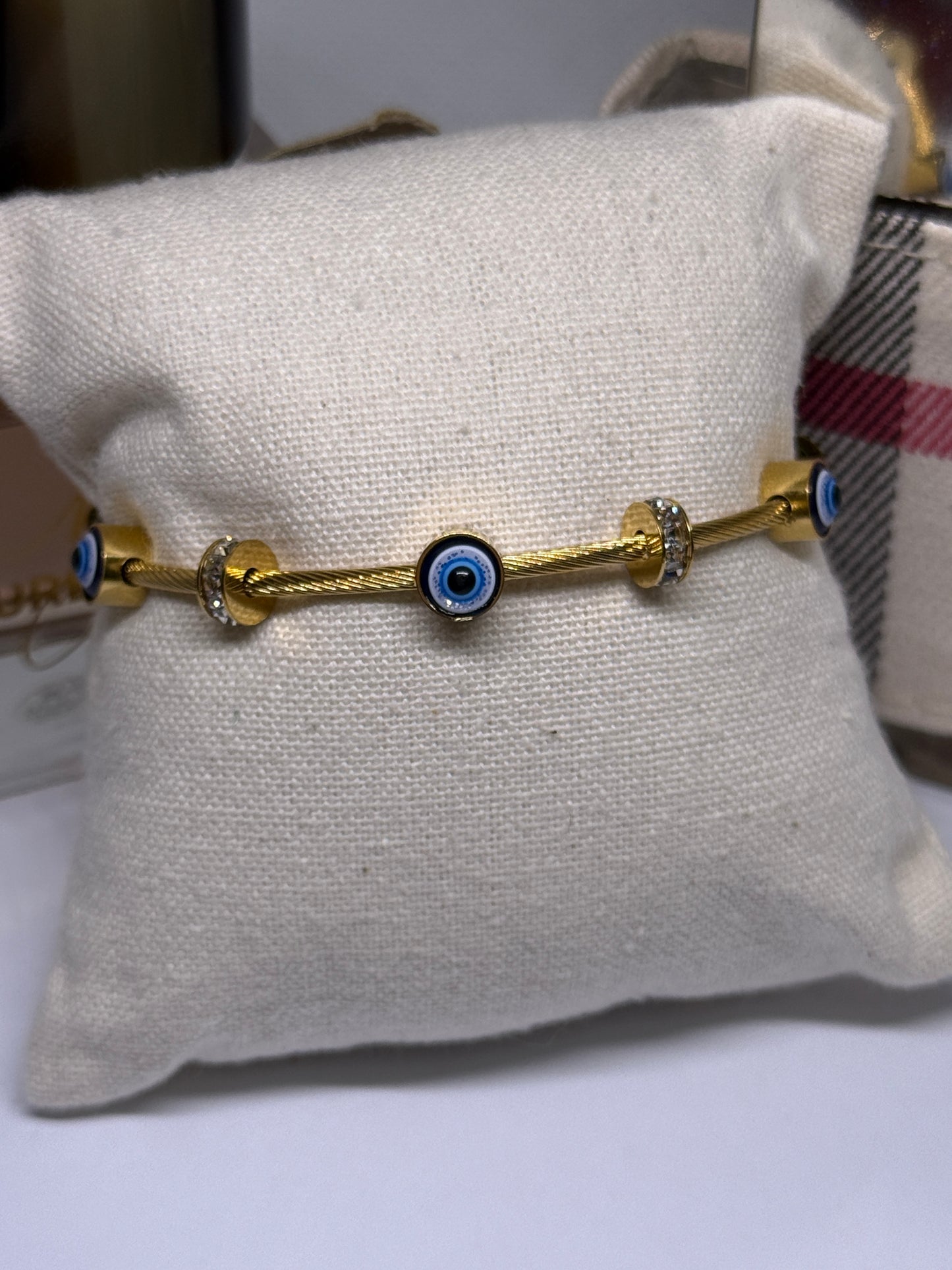 Gold evil eye bracelet with cubic zirconia and rhinestone details