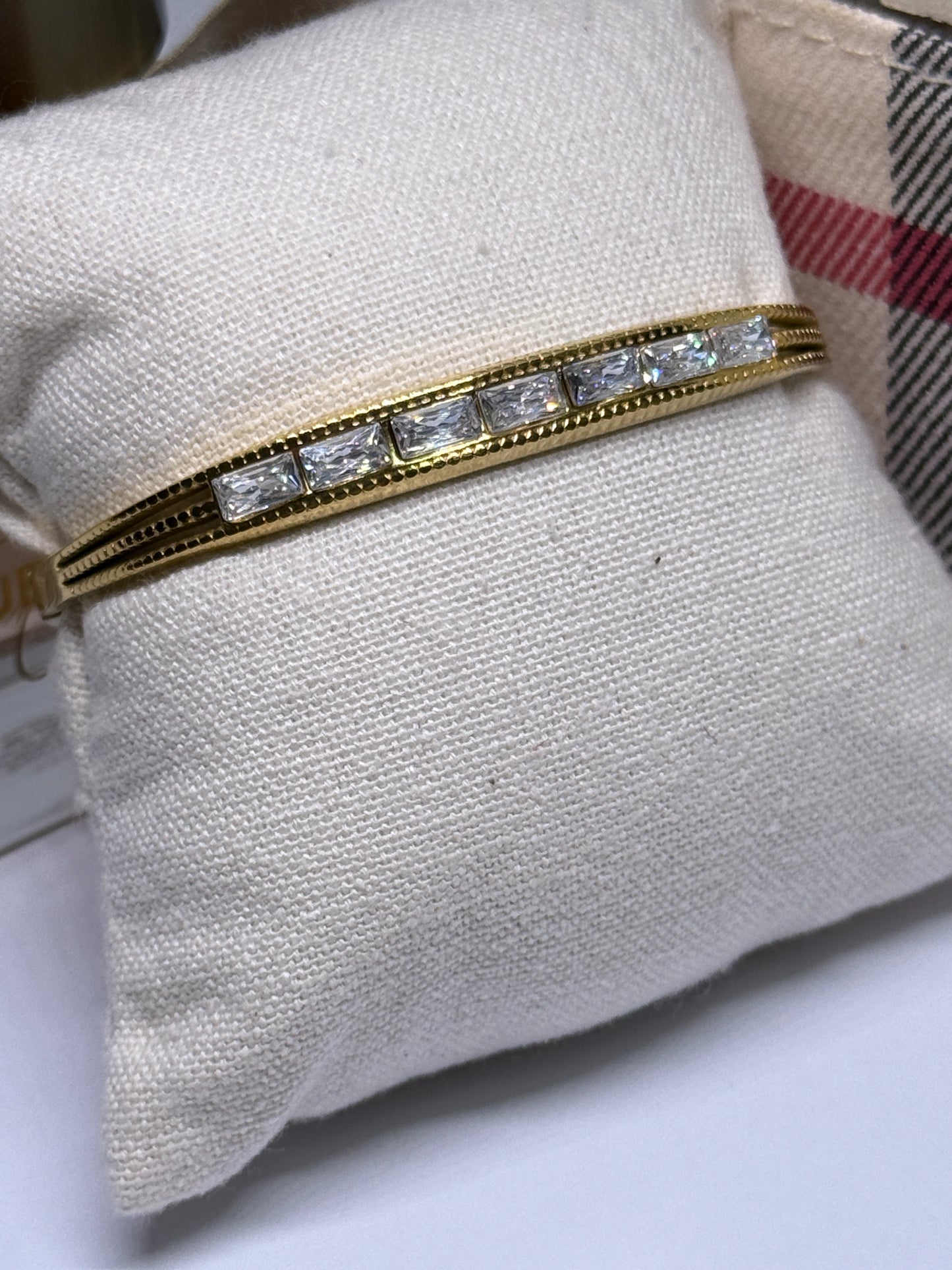 Gold bangle with glittering stone embossed