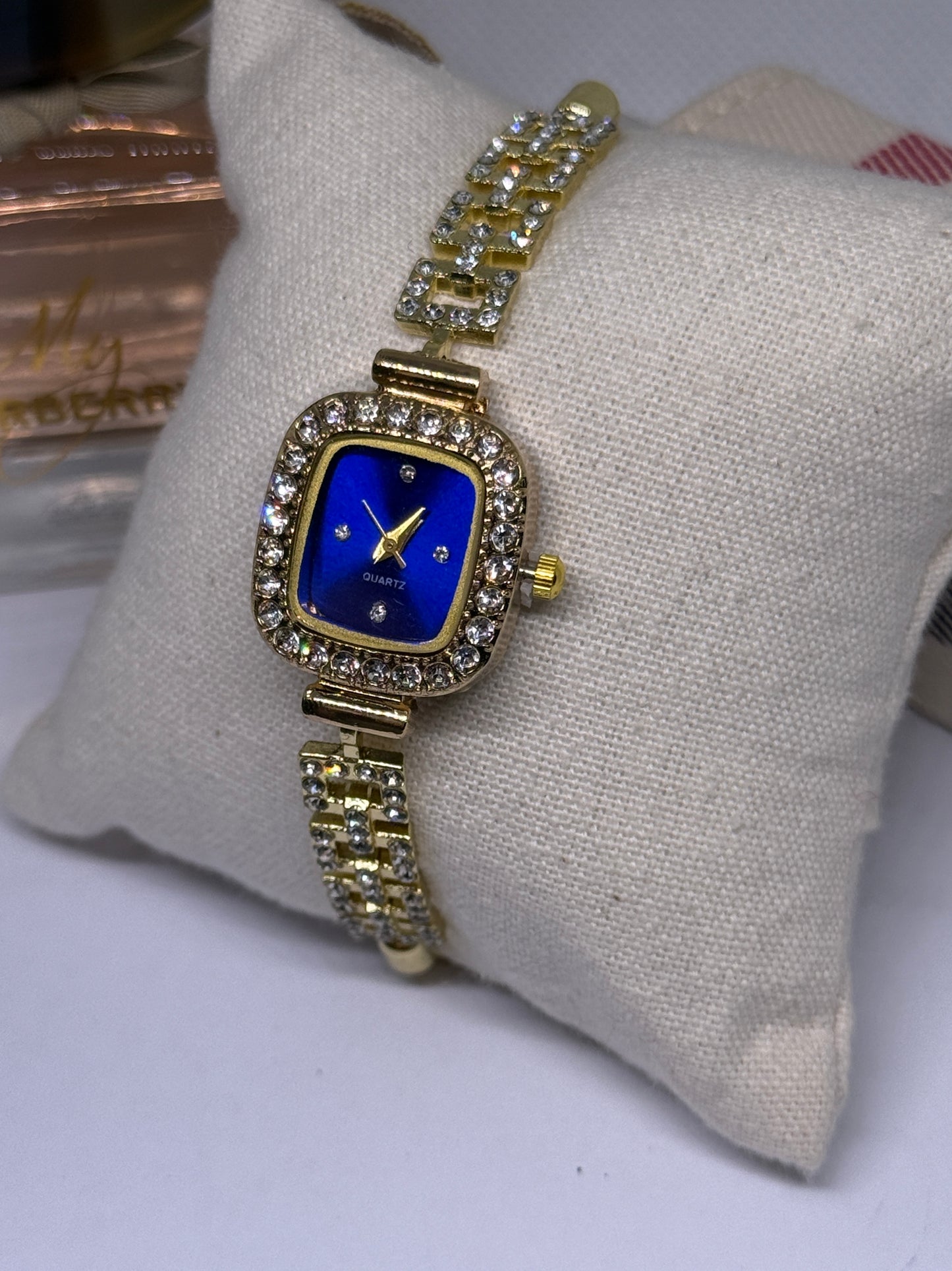Golden tone bracelet watch in blue