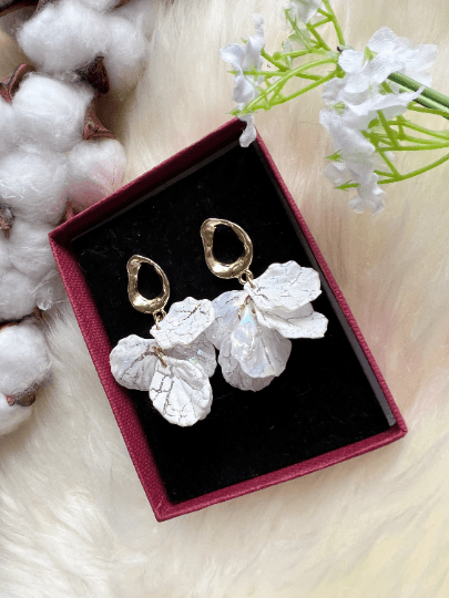 White pearlescent flowers dangly earrings | frosted petals statement earrings | golden floral earrings | bridal wedding party earrings - TuttyKnitty