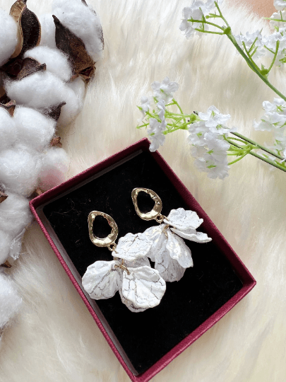 White pearlescent flowers dangly earrings | frosted petals statement earrings | golden floral earrings | bridal wedding party earrings - TuttyKnitty