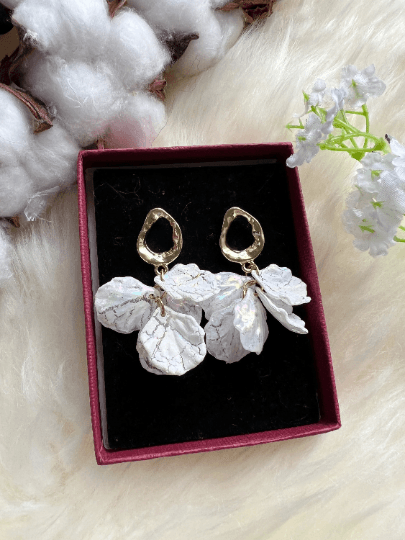 White pearlescent flowers dangly earrings | frosted petals statement earrings | golden floral earrings | bridal wedding party earrings - TuttyKnitty