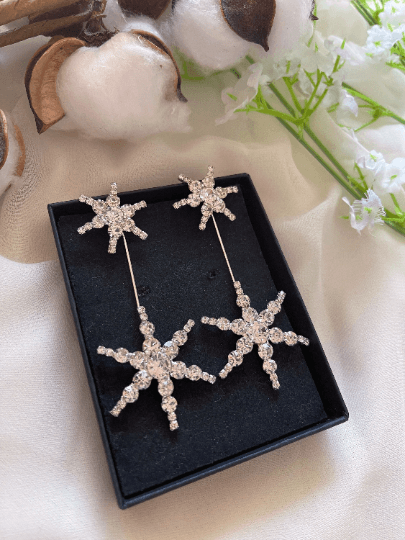 Gold glittering starburst earrings| silver stars diamante dangle earrings | Celestial snowflakes drop earrings | swing Christmas earrings - TuttyKnitty