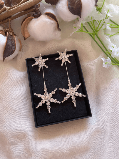 Gold glittering starburst earrings| silver stars diamante dangle earrings | Celestial snowflakes drop earrings | swing Christmas earrings - TuttyKnitty