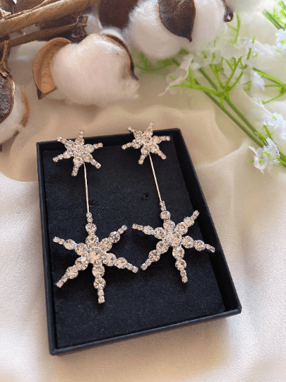 Gold glittering starburst earrings| silver stars diamante dangle earrings | Celestial snowflakes drop earrings | swing Christmas earrings - TuttyKnitty