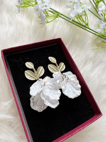 White pearlescent flowers dangly earrings | frosted petals statement earrings | golden floral earrings | bridal wedding party earrings - TuttyKnitty